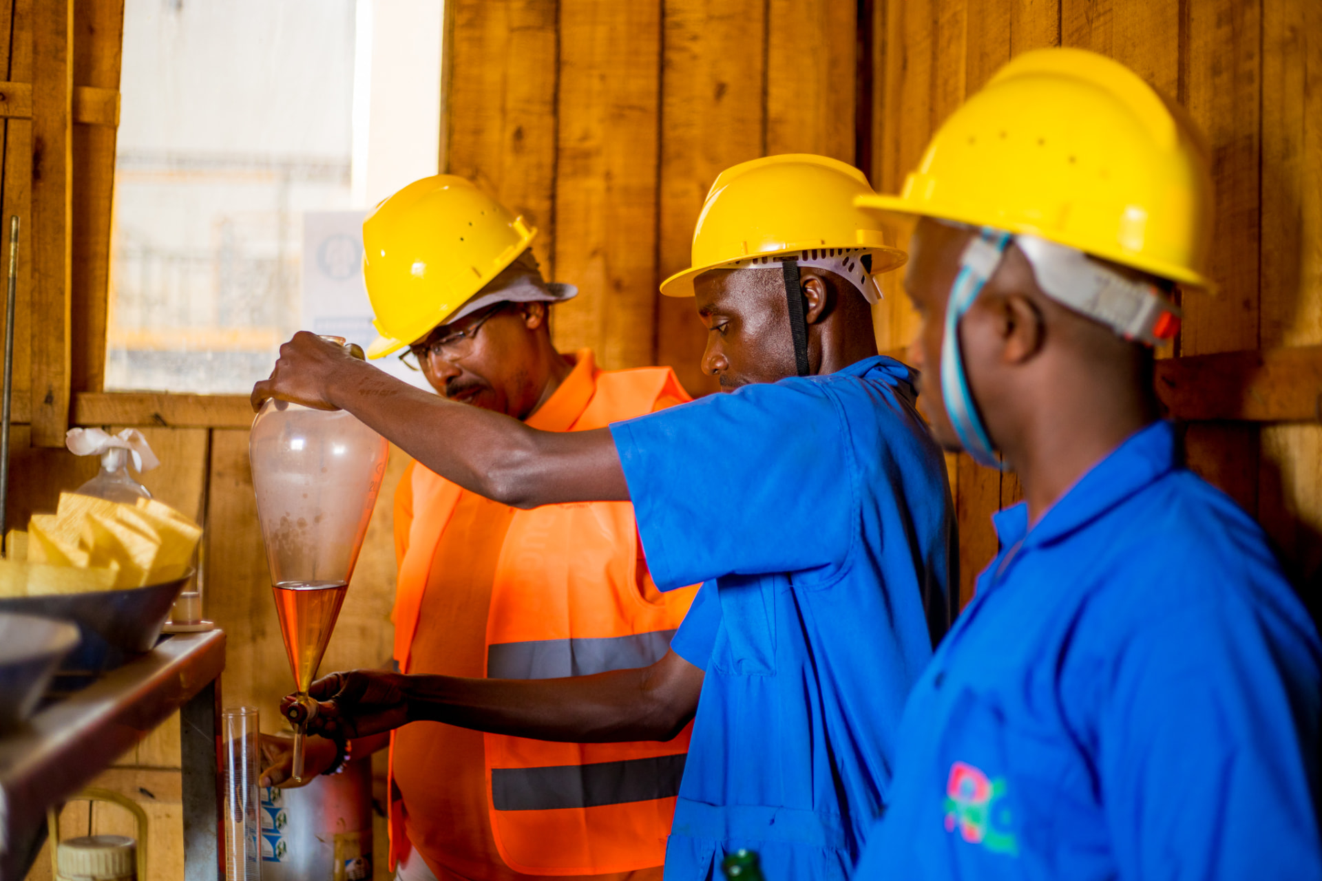 Rugofarm team performing quality control during distillation
