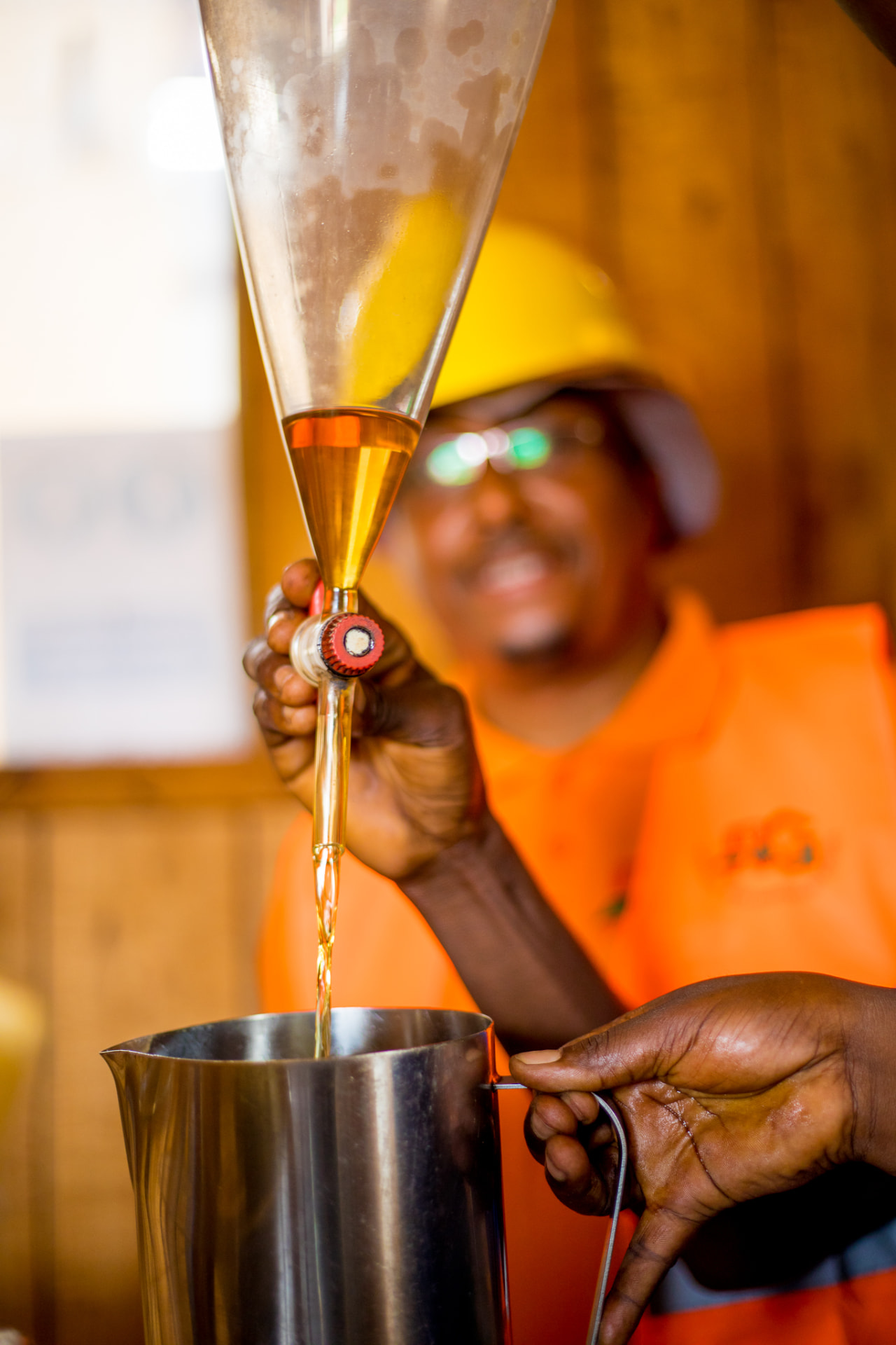 Freshly distilled patchouli essential oil being poured