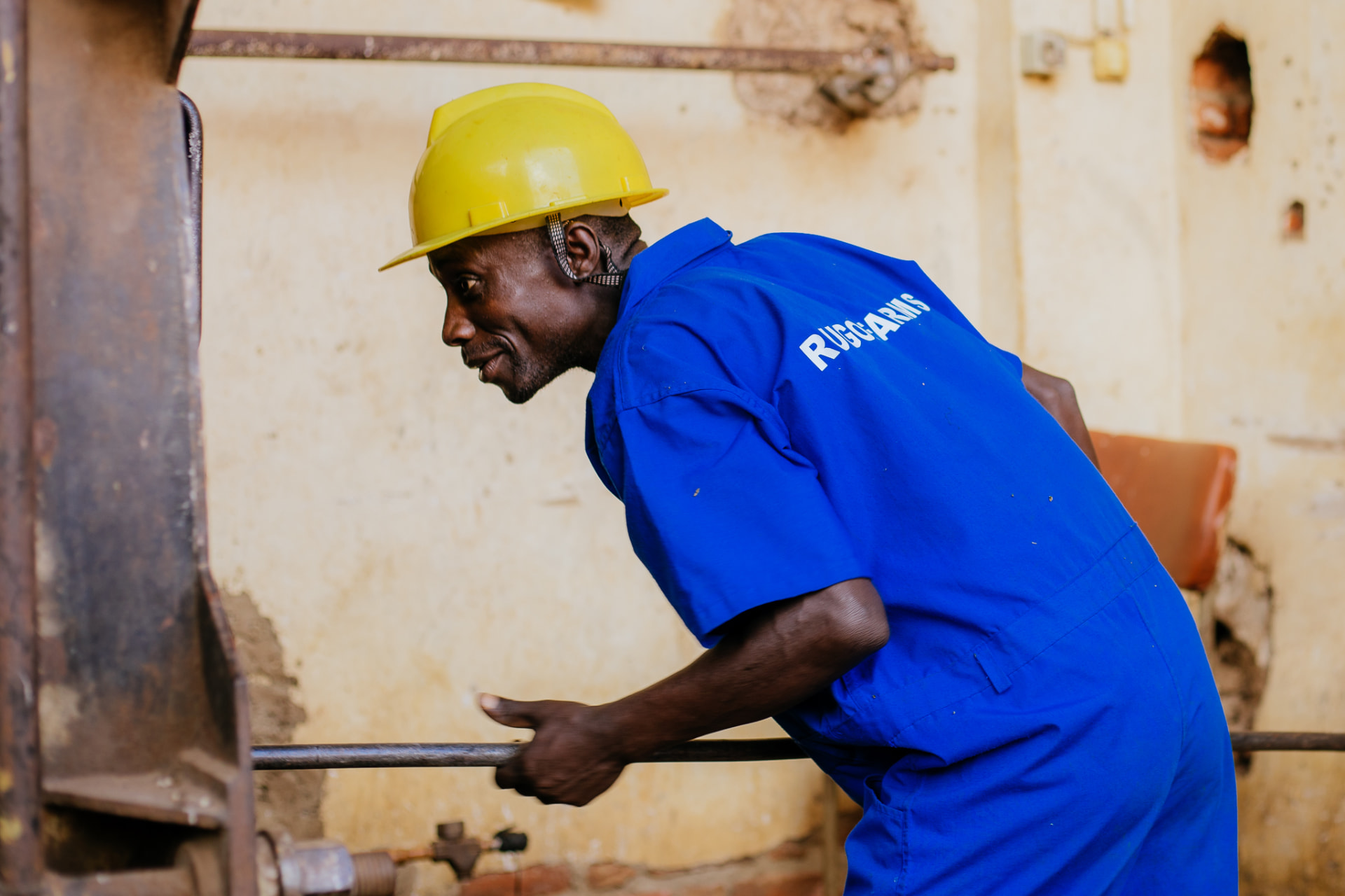 Rugofarm worker in protective gear at the distillery